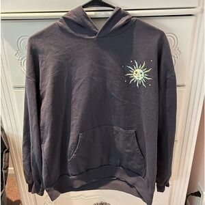 sweatshirt from macys with a sun and moon, size medium in women’s.